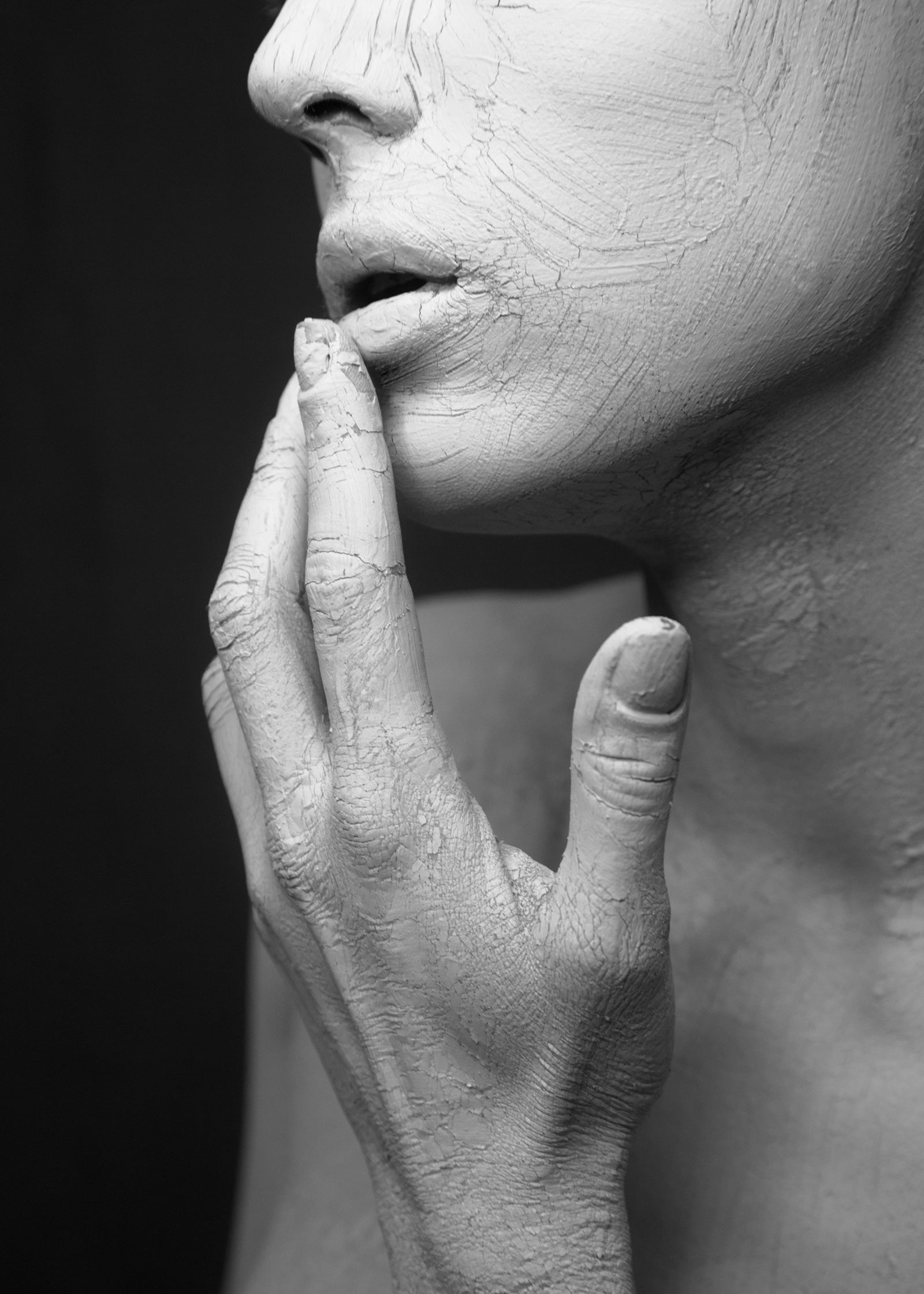 Image of a woman covered in clay mask on hands and face. Microneedling Radio Frequency treatment. Targeted facials at Teresa Tarmey Skin Clinic